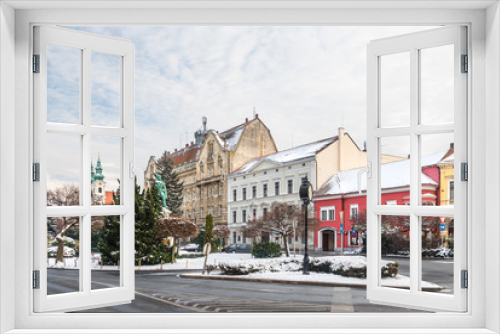 Fototapeta Naklejka Na Ścianę Okno 3D - Sopron old town winter cityscape: Szechenyi Square, the statue of Istvan Szechenyi, the Dominican Church and the Post Palace covered in snow