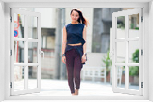 Asian female model poses for pictures on the street