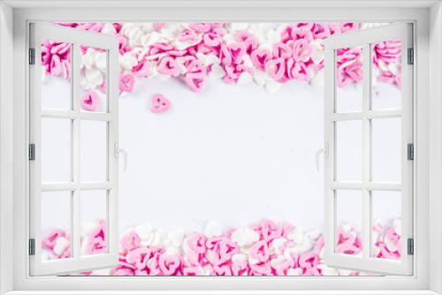Fototapeta Naklejka Na Ścianę Okno 3D - Valentine's sweets background, white background with sugar hearts sweet sprinkles, copy space top view, layout on white