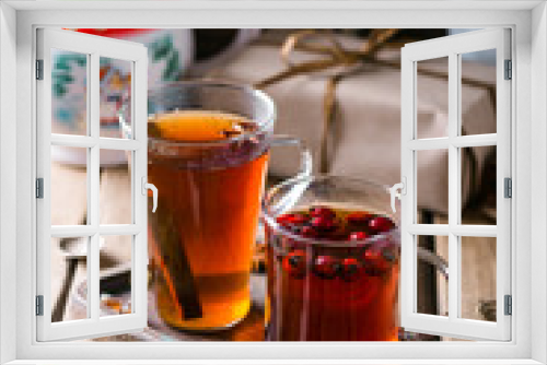 Fototapeta Naklejka Na Ścianę Okno 3D - Two mugs of tea, Drink with rosehip, Christmas composition, home comfort, wooden background