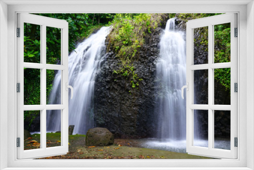 Fototapeta Naklejka Na Ścianę Okno 3D - View of a cascading waterfall in Tahiti, French Polynesia