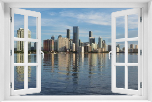 Fototapeta Naklejka Na Ścianę Okno 3D - Miami, Florida 09-08-2018 City of Miami skyline and its reflection on the tranquil water of Biscayne Bay.