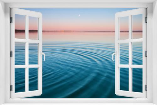 Fototapeta Naklejka Na Ścianę Okno 3D - The turquoise lake at dawn.small symmetrical waves