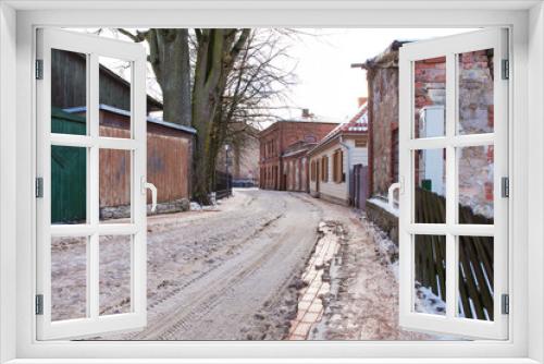 Fototapeta Naklejka Na Ścianę Okno 3D - Old town buildings, street and urban view. Winter and snow. Travel photo 2018.