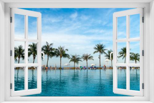 Fototapeta Naklejka Na Ścianę Okno 3D - People has relax between the swimming pool and the tropical sea at the morning time.