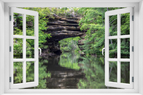 Fototapeta Naklejka Na Ścianę Okno 3D - Kayaking the Natural Arch in Pickett State Park in Jamestown, Tennessee. This popular state park allows visitors to rent kayaks and view the the natural bridge up close. 