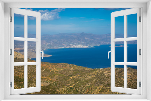 Fototapeta Naklejka Na Ścianę Okno 3D - Agios Nikolaos, Crete - 09 29 2018: Moni Faneromenis Monastery. Panorramic view of Mirabello Bay