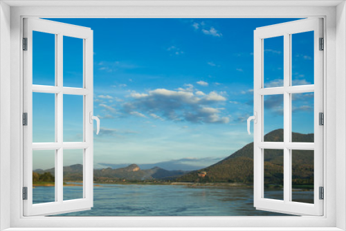 Fototapeta Naklejka Na Ścianę Okno 3D - Mountains and River with a white cloud and blue sky background.