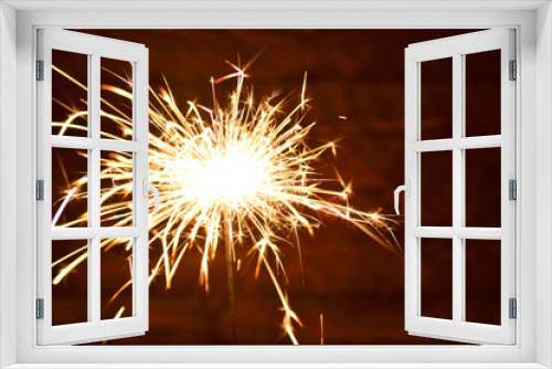 Fototapeta Naklejka Na Ścianę Okno 3D - Holiday Bengal lights on the dark background. Burning sparkler, Happy New Year.