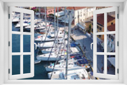 Fototapeta Naklejka Na Ścianę Okno 3D - Aerial drone bird's eye view photo of iconic small safe port of Gaios with traditional Ionian architecture and sail boats docked, Paxos island, Ionian, Greece