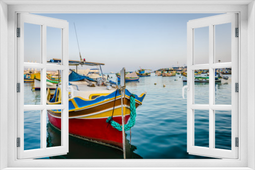 Fototapeta Naklejka Na Ścianę Okno 3D - Traditional eyed colorful boats Luzzu in the Harbor of Mediterranean fishing village Marsaxlokk, Malta