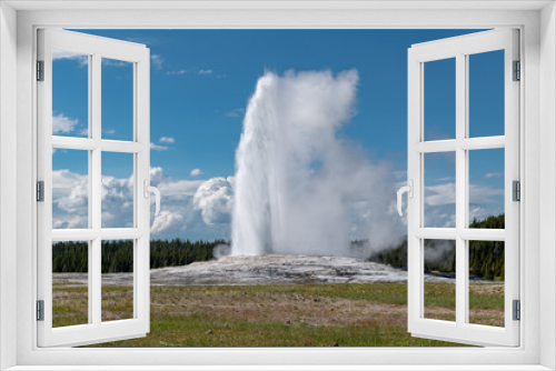 Fototapeta Naklejka Na Ścianę Okno 3D - Eruption of Old Faithful geyser at Yellowstone National Park USA