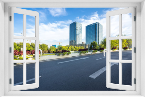 Fototapeta Naklejka Na Ścianę Okno 3D - empty road with city skyline