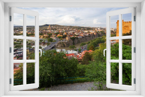 Fototapeta Naklejka Na Ścianę Okno 3D - Panorama view of Tbilisi, capital of Georgia country. View from Narikala fortress. Cable road above tiled roofs.
