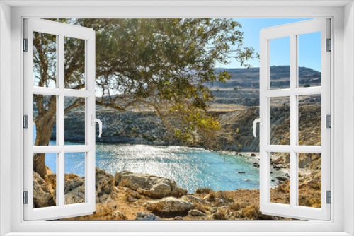 Fototapeta Naklejka Na Ścianę Okno 3D - LINDOS,RHODES/GREECE OCTOBER 29 2018 : Lindos village and the endless Aegean sea photo taken from Kleovoulos Tomb hill.