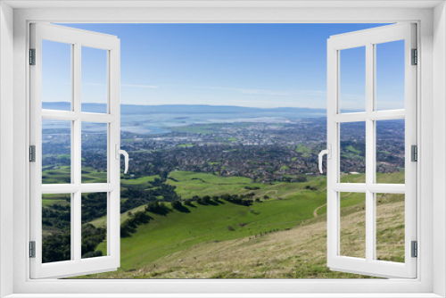 Fototapeta Naklejka Na Ścianę Okno 3D - View towards Fremont from the trail to Mission Peak, cattle grazing on the hills, east San Francisco bay, California