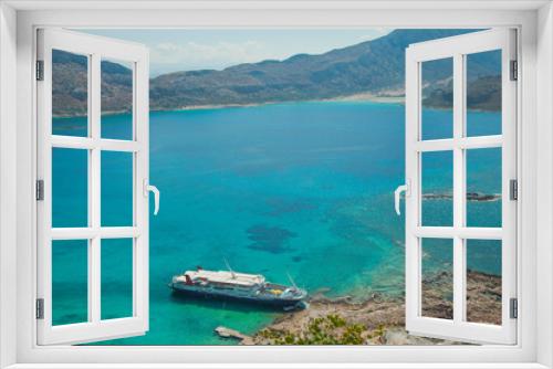 Fototapeta Naklejka Na Ścianę Okno 3D - Balos lagoon on Crete island in Greece. Tourist boat in crystal clear water of Balos beach.