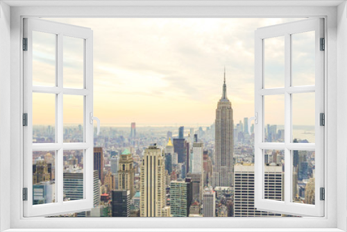 Fototapeta Naklejka Na Ścianę Okno 3D - Empire State Building and skyscrapers at Manhattan skyline in New York City.