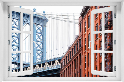 Fototapeta Naklejka Na Ścianę Okno 3D - Bridge and brick industrial buildings. The famous suspension Manhattan Bridge photographed from DUMBO district in Brooklyn, New York City.