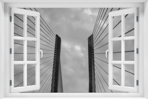 Fototapeta Naklejka Na Ścianę Okno 3D - Black and white low-angle view of Vasco da Gama Bridge in Portugal