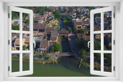 Fototapeta Naklejka Na Ścianę Okno 3D - Aerial view of Chua Cau (the Pagoda Bridge) or The Japanese Covered Bridge in Hoi An old town or Hoian ancient town. The Pagoda Bridge is one of the famous tourist and travel in Hoi An, Vietnam