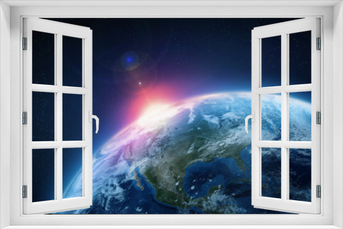 Fototapeta Naklejka Na Ścianę Okno 3D - Planet Earth. View from orbit. Bright flash in space against the background of stars. Elements of this image furnished by NASA