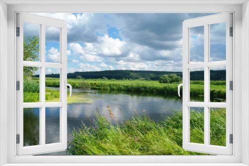 Fototapeta Naklejka Na Ścianę Okno 3D - river, land with trees and cloudy sky