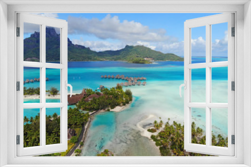 Fototapeta Naklejka Na Ścianę Okno 3D - Aerial panoramic landscape view of the island of Bora Bora in French Polynesia with the Mont Otemanu mountain surrounded by a turquoise lagoon, motu atolls, reef barrier, and the South Pacific Ocean