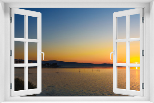 Fototapeta Naklejka Na Ścianę Okno 3D - View of sunrise in lagoon Orbetello on peninsula Argentario. Italy