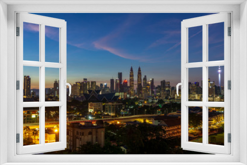 Fototapeta Naklejka Na Ścianę Okno 3D - KUALA LUMPUR, MALAYSIA - 13th JAN 2019; Majestic sunrise over downtown Kuala Lumpur, Malaysia.	