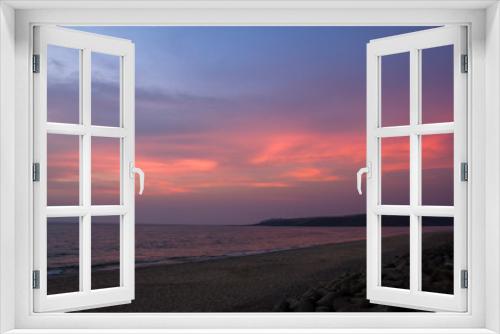 Fototapeta Naklejka Na Ścianę Okno 3D - pink clouds in the blue purple sky against the background of the evening sea and sandy beach