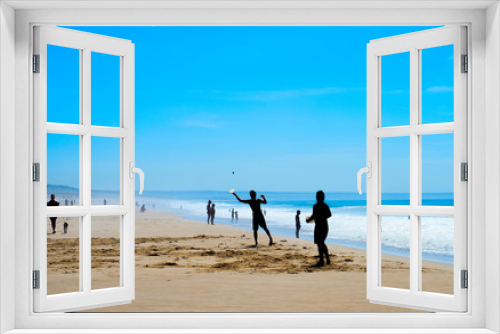 Fototapeta Naklejka Na Ścianę Okno 3D - People playing beach racket silhouette