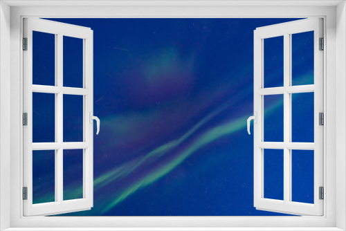 Fototapeta Naklejka Na Ścianę Okno 3D - The polar arctic Northern lights aurora borealis sky star in Norway Svalbard in Longyearbyen the moon mountains