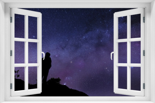 Fototapeta Naklejka Na Ścianę Okno 3D - Silhouette of a man watching the Milky way and the Stars