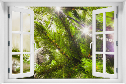 Fototapeta Naklejka Na Ścianę Okno 3D - decorations on an artificial green christmas pine tree at home