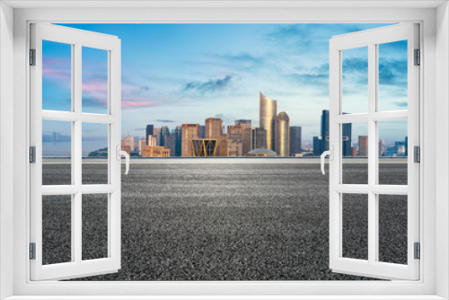 Fototapeta Naklejka Na Ścianę Okno 3D - Empty asphalt road and city skyline at sunrise in hangzhou