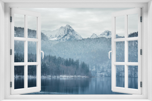 Fototapeta Naklejka Na Ścianę Okno 3D - Amazing winter landscape of alpine lake with crystal clear water and mountains in background
