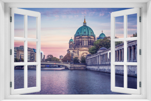 Fototapeta Naklejka Na Ścianę Okno 3D - Looking across the river at the Berlin Cathedral during a colorful sunset 