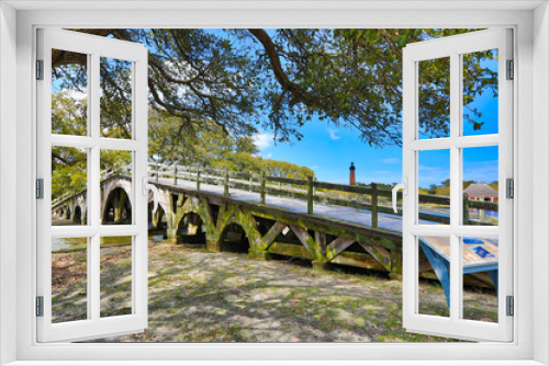 Fototapeta Naklejka Na Ścianę Okno 3D - The historic landmark footbridge in Currituck Heritage Park leads to the Whalehead Club. This is located in the Outer Banks of North Carolina. 