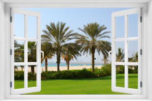 Fototapeta Naklejka Na Ścianę Okno 3D - Palms at the beach of  luxury hotel, Dubai, UAE
