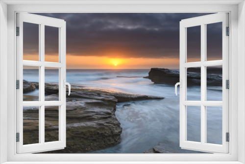 Fototapeta Naklejka Na Ścianę Okno 3D - An Atmospheric Sunrise Seascape
