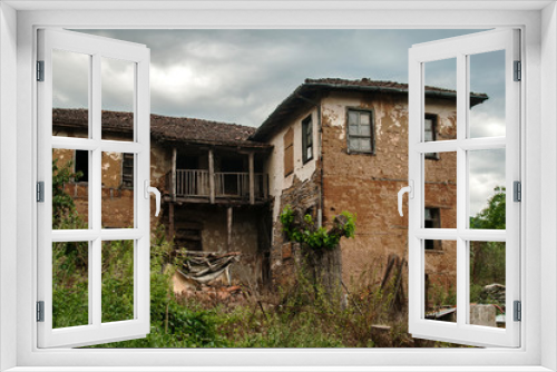 Fototapeta Naklejka Na Ścianę Okno 3D - Old abandoned weathered retro vintage rural brick wall house