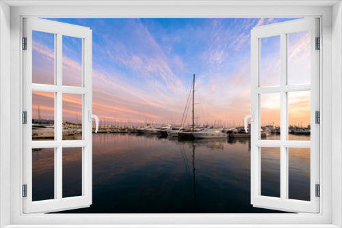 Fototapeta Naklejka Na Ścianę Okno 3D - Beautiful port of Alicante, Spain at Mediterranean sea. Luxury yachts, ships, ferries and fishing boats sailing and standing in rows in harbor. Rich people traveling around the world. Sunset evening  