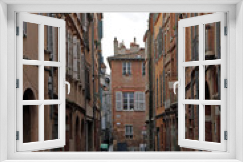 Fototapeta Naklejka Na Ścianę Okno 3D - the narrow street in french city Toulouse