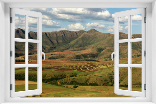 Fototapeta Naklejka Na Ścianę Okno 3D - Landscape of field and mountains at Lesotho country in Africa. Blue sky and white clouds in a midday. Kingdom of mountain.