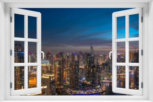 Fototapeta Naklejka Na Ścianę Okno 3D - Panoramic view over famous Dubai Marina skyline. Colorful background with modern skyscrapers and glittering night lights