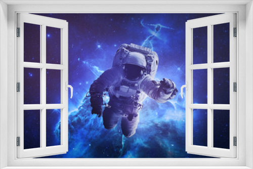 Fototapeta Naklejka Na Ścianę Okno 3D - Astronaut Afloat - Elements of this Image Furnished by nASA