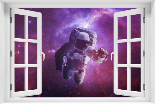 Fototapeta Naklejka Na Ścianę Okno 3D - Astronaut Afloat - Elements of this Image Furnished by nASA