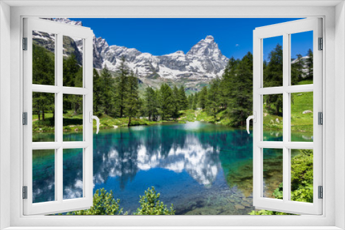 Fototapeta Naklejka Na Ścianę Okno 3D - Summer alpine landscape with the Matterhorn (Cervino) reflected on the Blue Lake (Lago Blu) near Breuil-Cervinia, Aosta Valley, northern Italy