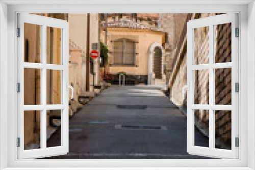 Fototapeta Naklejka Na Ścianę Okno 3D - Empty alley of european old town, Cannes France